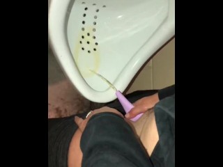 Girl Pissing into a Urinal & her Husband gets to Witness it first hand as he pisses right after her