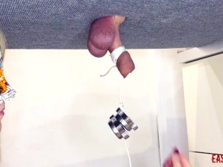 Mistress plays with the slave's dick and hangs weights on him EasyCBTGirl