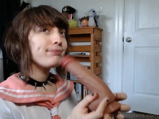 femboy schoolgirl gives a blowjob to his toy