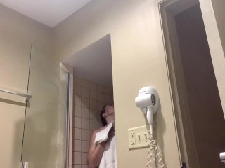 See this HOT big titty DD blonde MILF shower and apply makeup in her hotel