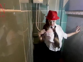Nice lady in the shower in wet clothes and a hat. Striptease dancing in the shower. 1