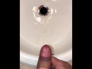 Naughty Pissing and Cumming in my bathroom sink featuring a bullseye cumshot into the drain