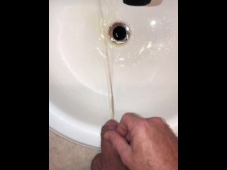 Naughty Pissing and Cumming in my bathroom sink featuring a bullseye cumshot into the drain