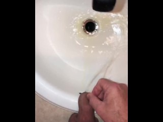 Naughty Pissing and Cumming in my bathroom sink featuring a bullseye cumshot into the drain