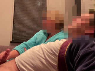 Casual handjob from wife while watching tv on couch