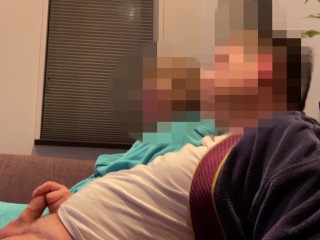 Casual handjob from wife while watching tv on couch