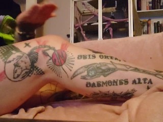 Putting body lotion on my tattooed legs