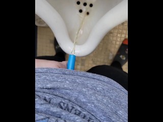 Girl uses shewee to piss in urinal