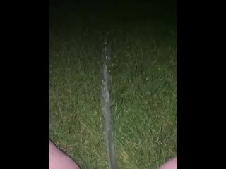 spraying piss in backyard