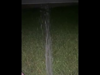 spraying piss in backyard