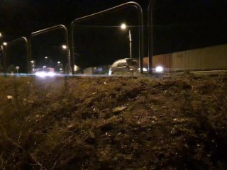 Young guy flashing cars near busy road