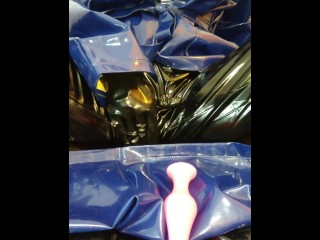 Solo masturbation in PVC raincoat and latex