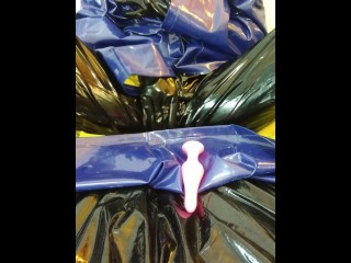 Solo masturbation in PVC raincoat and latex