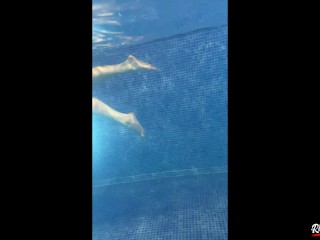 A Russian is swimming in the pool. view of pd with water on a naked girl