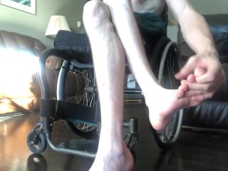 Pasty white numb legs of a paraplegic 