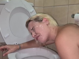 Human toilet whore gets pissed on over the toilet | golden shower