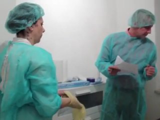 Doc and nurse stretching male patients ass - PREVIEW
