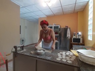 Nudist housekeeper Regina Noir cooking at the kitchen. Naked maid makes dumplings. Naked cooks Bra