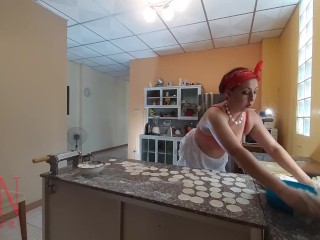 Nudist housekeeper Regina Noir cooking at the kitchen. Naked maid makes dumplings. Naked cooks Bra