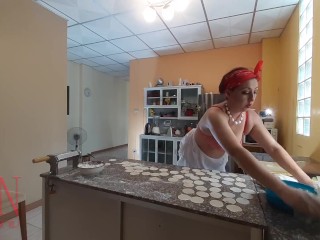 Nudist housekeeper Regina Noir cooking at the kitchen. Naked maid makes dumplings. Naked cooks. Bra