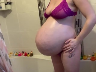 Rubbing my massive pregnant belly for you 