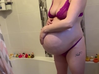 Rubbing my massive pregnant belly for you 