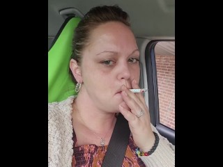 HOT Babe having a smoke while waiting in the car