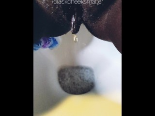 Ebony wife peeing a golden stream