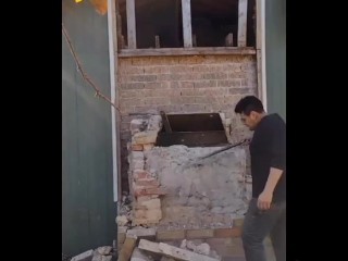 Demolishing a brick chimney