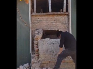 Demolishing a brick chimney