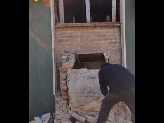 Demolishing a brick chimney