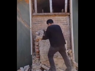 Demolishing a brick chimney