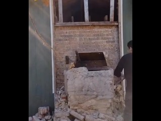 Demolishing a brick chimney