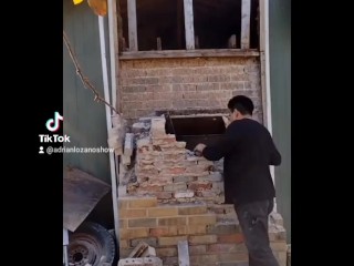 Demolishing a brick chimney