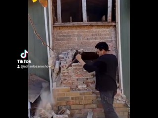 Demolishing a brick chimney