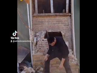 Demolishing a brick chimney