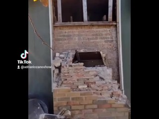 Demolishing a brick chimney