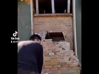 Demolishing a brick chimney