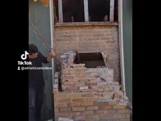 Demolishing a brick chimney