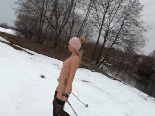 Naked girl skiing in the countryside