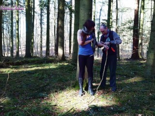 Girl bound in public to tree in forest and suspended; almost discovered!