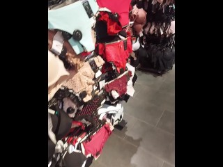 MILF on shopping, walking around the lingerie store, trying on bras in the fitting room