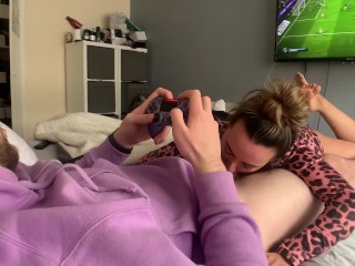 He tries to play FIFA while she plays with his COCK!! 