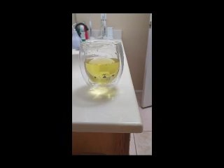 CreamyPussySlut pissing in a cup