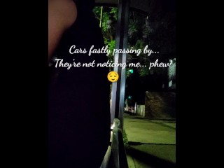 Sissy slut sitting on a huge dildo in public bus station at night while cars pass by