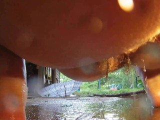 Chubby slut girl pees up close in front of securty camera and drips all over her feet into a puddle