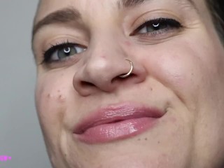 Pretty girl plays with nose nostrils picking nose