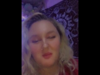 seductive teen takes a bite out of a giant gummy bear