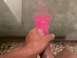 Cute boy having fun with dildo in shower