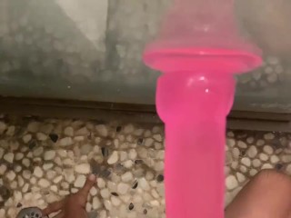 Cute boy having fun with dildo in shower